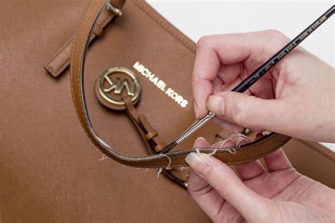 how to fix a michael kors purse strap|Michael Kors signature tote strap.